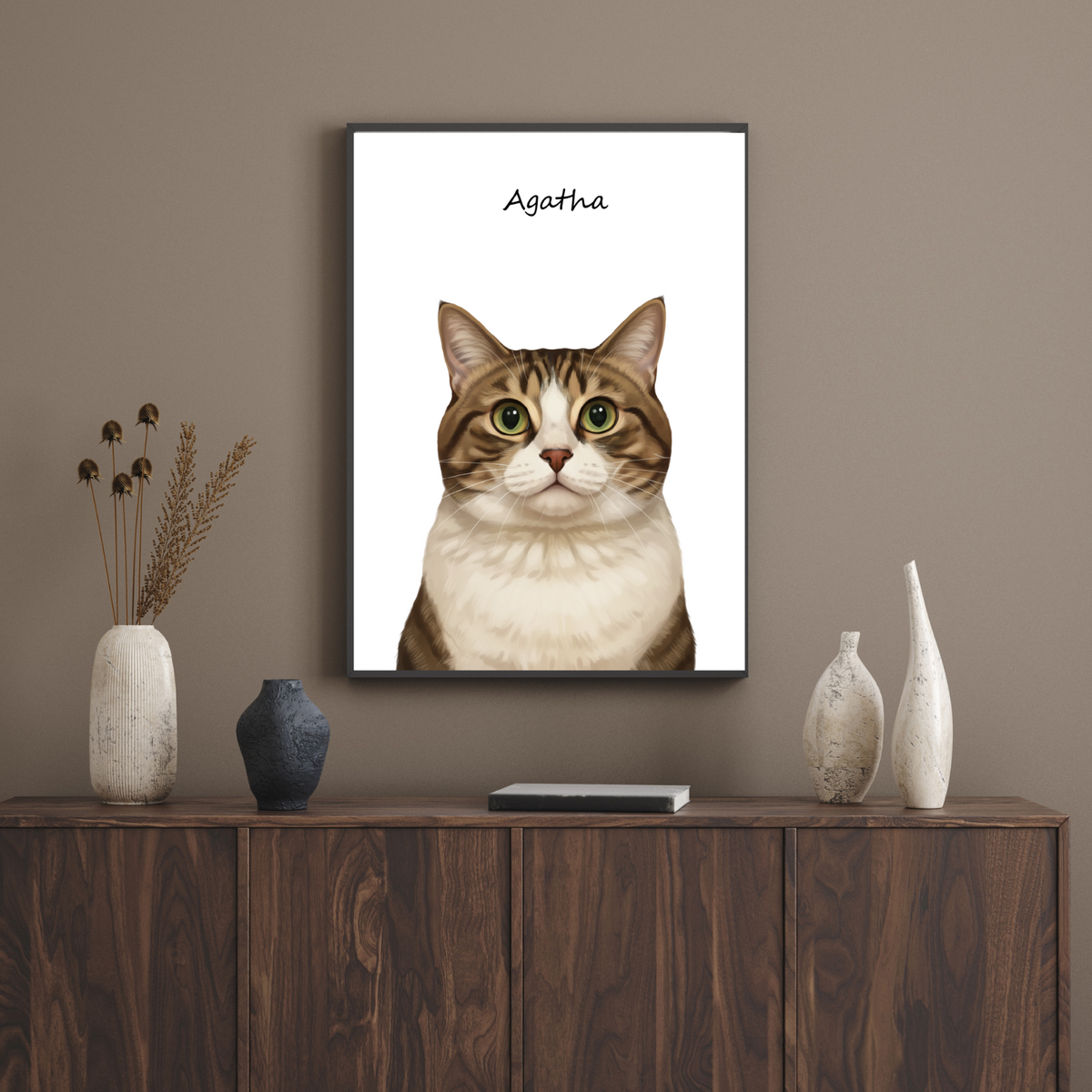 Framed portrait of a tabby cat named Agatha, illustrated in a digital art style, displayed on a wooden cabinet wall.