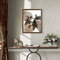 Framed print of a realistic pet portrait featuring three cute cats looking down, set against a bright, minimalist background.