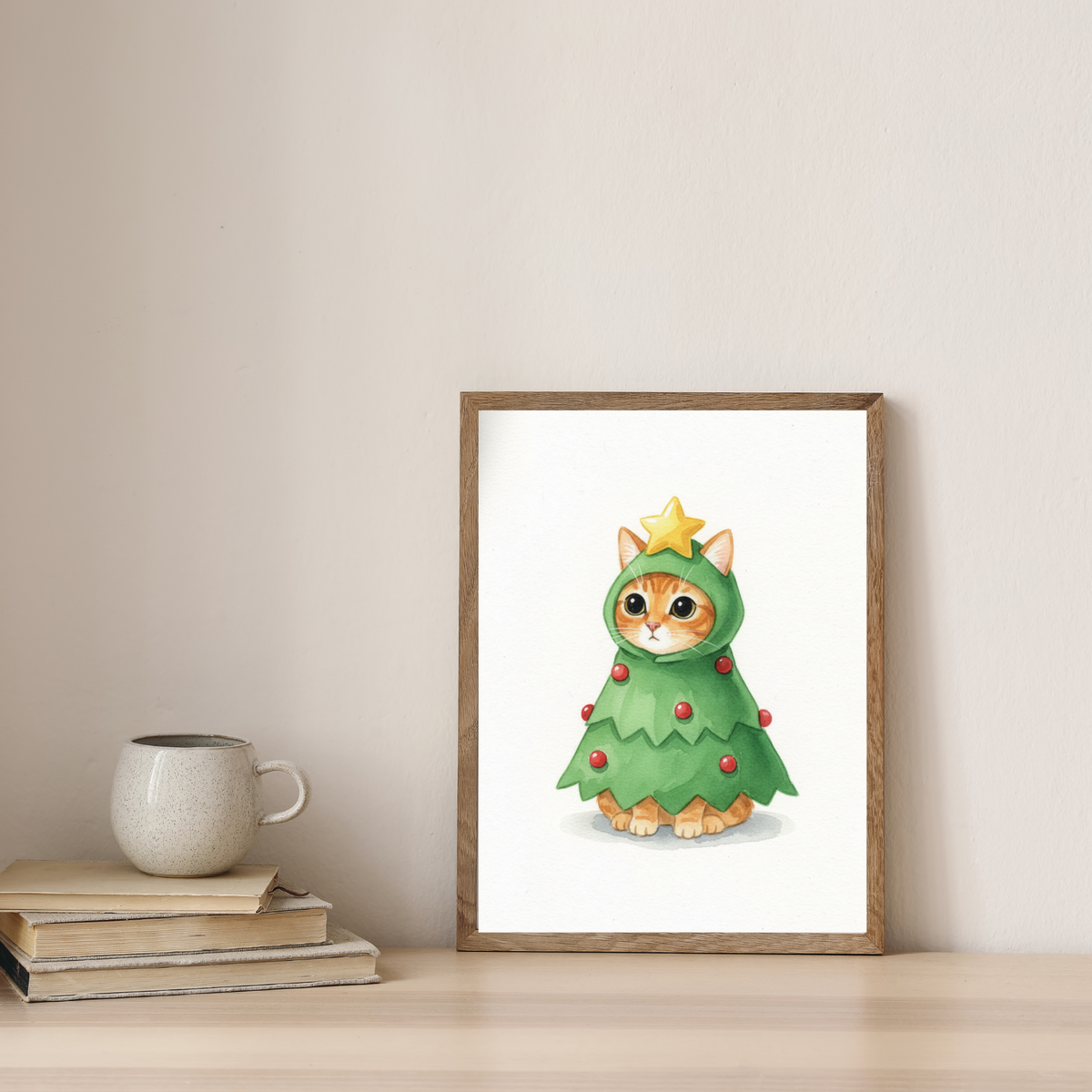 A framed watercolor print of an orange cat wearing a festive Christmas tree costume with a star topper on a