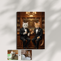 Framed print of an oil painting style portrait showing a grey and an orange cat in tuxedos sitting at a