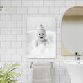 Framed print of a cheerful baby in a bubble bath with a rubber duck on their head, shown in a