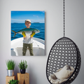 Framed print of a child in a beige cap and yellow gloves holding a fish on a boat, displayed in