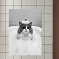 A framed wall print featuring a black-and-white stylized portrait of a fluffy cat wearing a bubble hat and rubber duck.