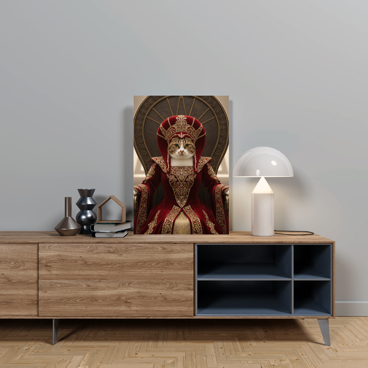 A framed print of a cat dressed as Padmé Amidala in royal red robes, seated on a throne in an