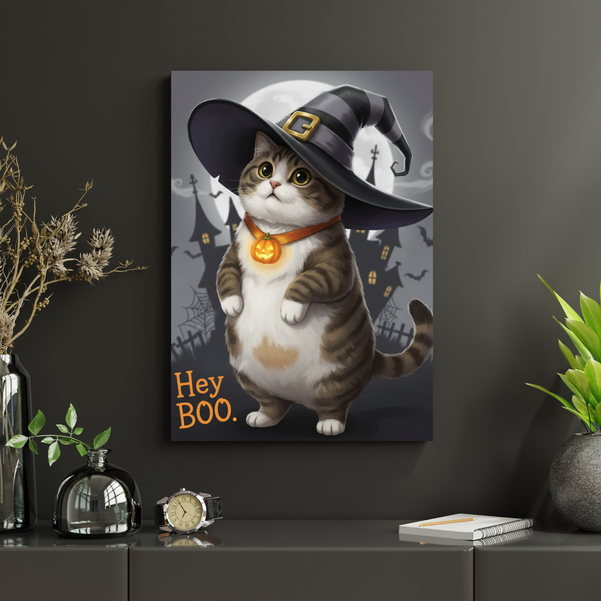 Framed print of a cartoon-style tabby cat wearing a witch hat and pumpkin necklace, set against a spooky Halloween castle.
