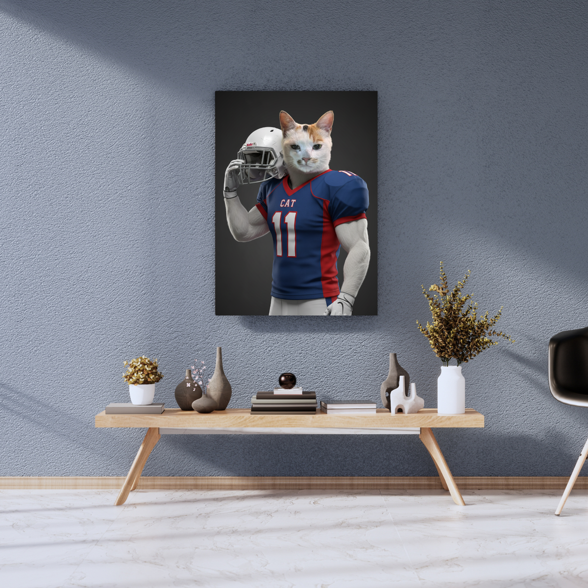 Framed print of a realistic cat in a football jersey holding a helmet, displayed on a wall above a wooden