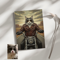 A framed print of an oil-style portrait featuring a grey and white cat wearing a leather jacket, riding on a