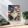 Framed oil painting print of a grey and white fluffy cat against an American flag background, displayed in a room