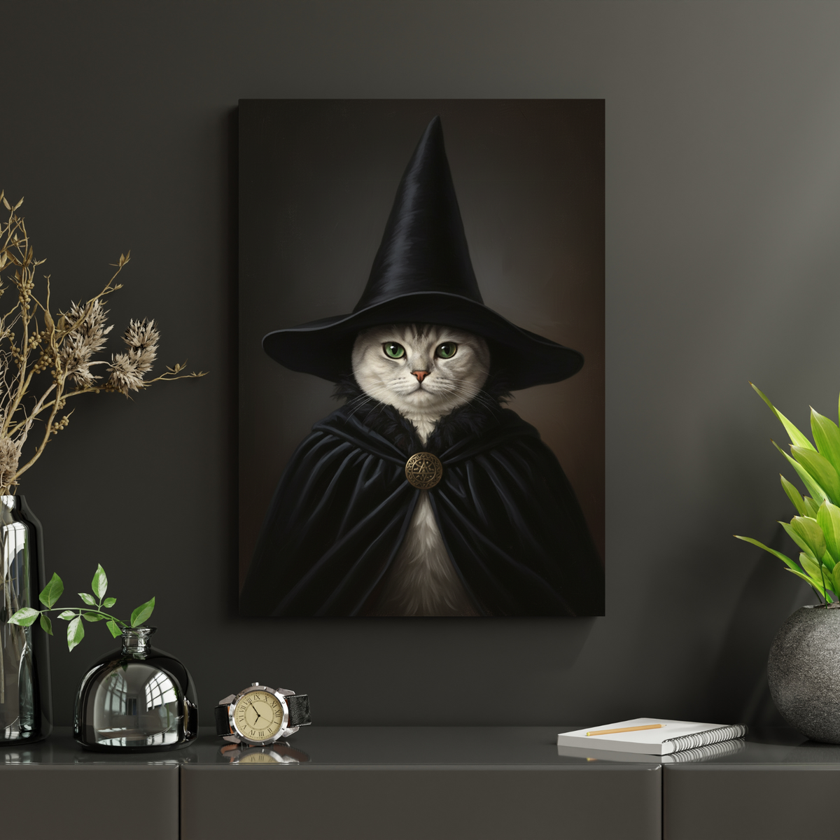 A framed oil painting of a cat dressed as a witch in a black cloak and hat, displayed in a