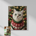 A framed wall print of an oil-style portrait featuring a cat in a festive holiday sweater against a lit Christmas