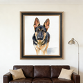 Framed watercolor portrait of a German Shepherd on a white background, hanging in a modern living room above a sofa.