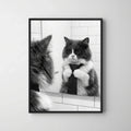 Framed print of a black and white portrait featuring a fluffy cat adjusting its tie in a bathroom mirror.